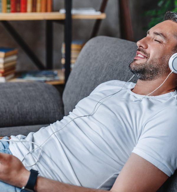 Man Relaxing Listening To Braintap Personal Wellness Sessions